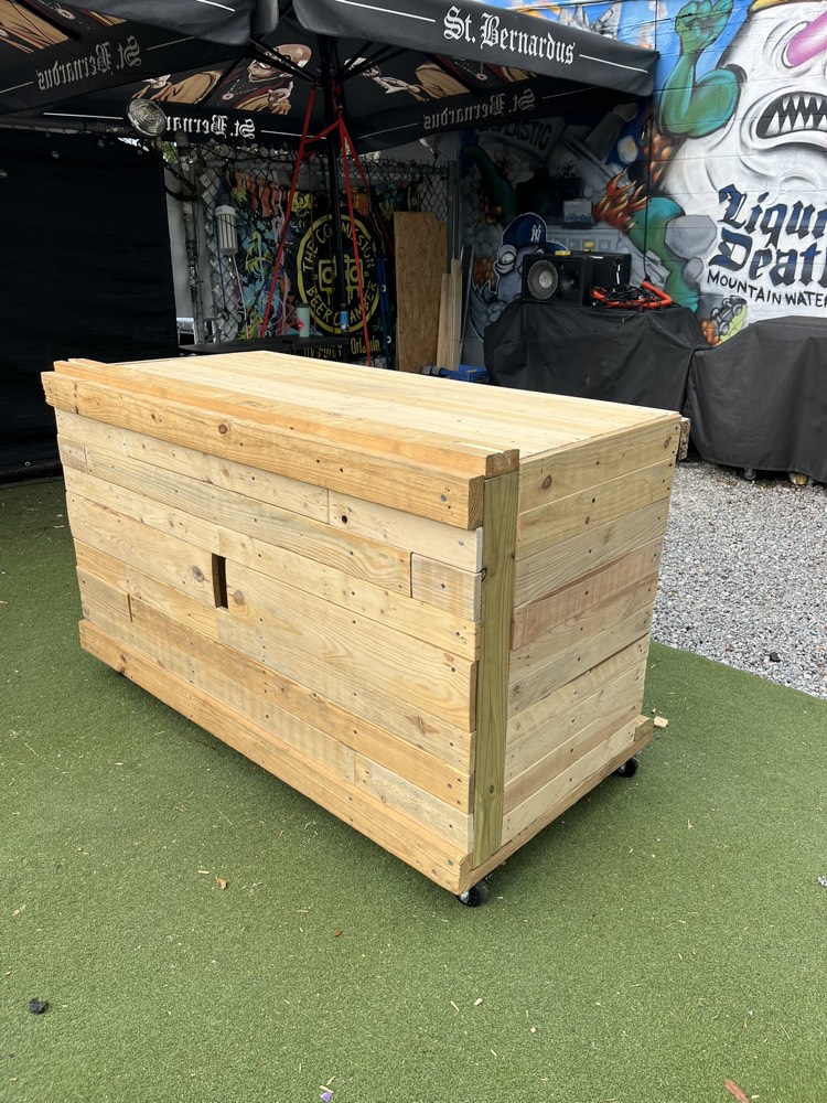 The finished DJ Pallet Table — a mobile pallet booth on casters